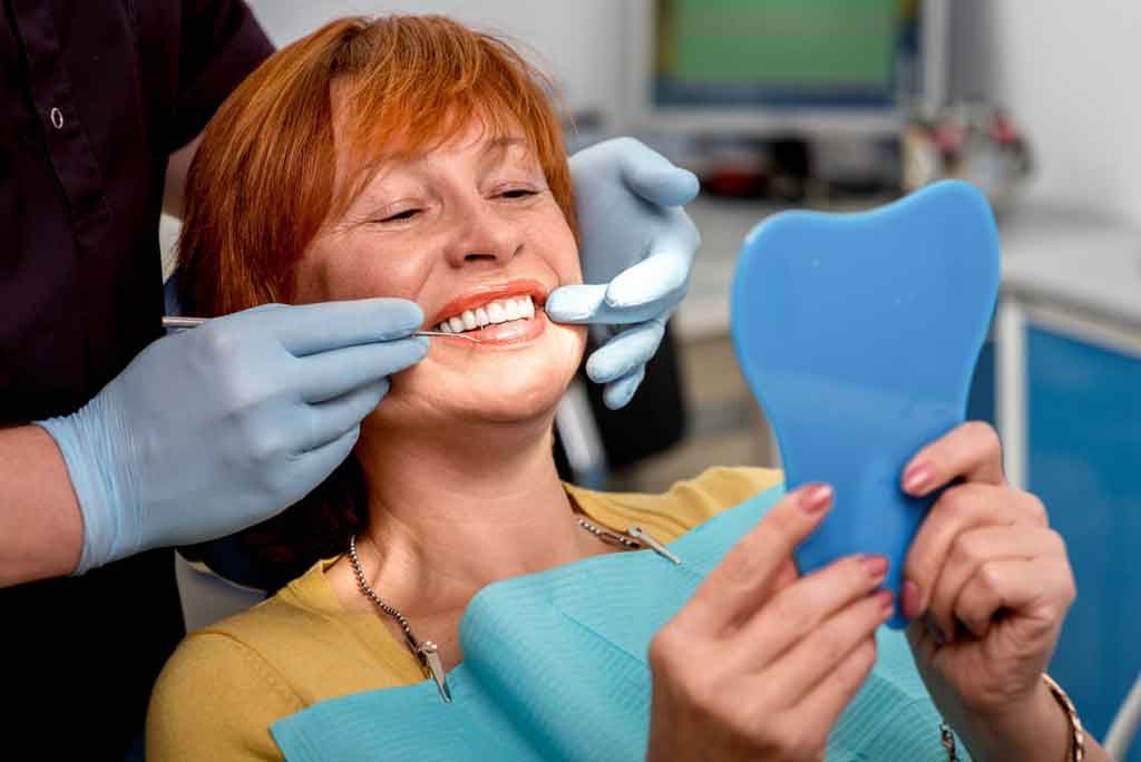 Confident adult smiling after personalized dental implant treatment planning in Tempe Arizona